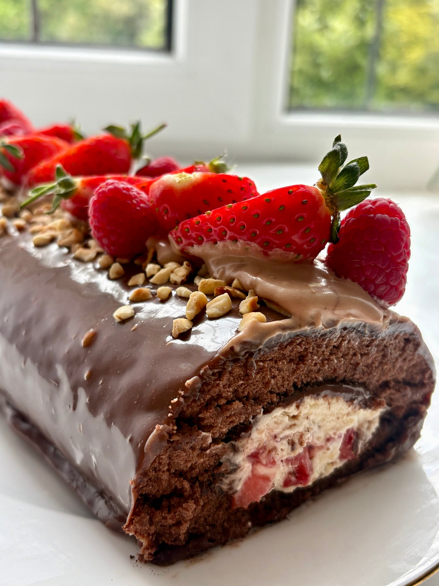 Chocolate swiss roll filled with strawberries and cream covered with milk chocolate ganache ❤️- pdf recipe