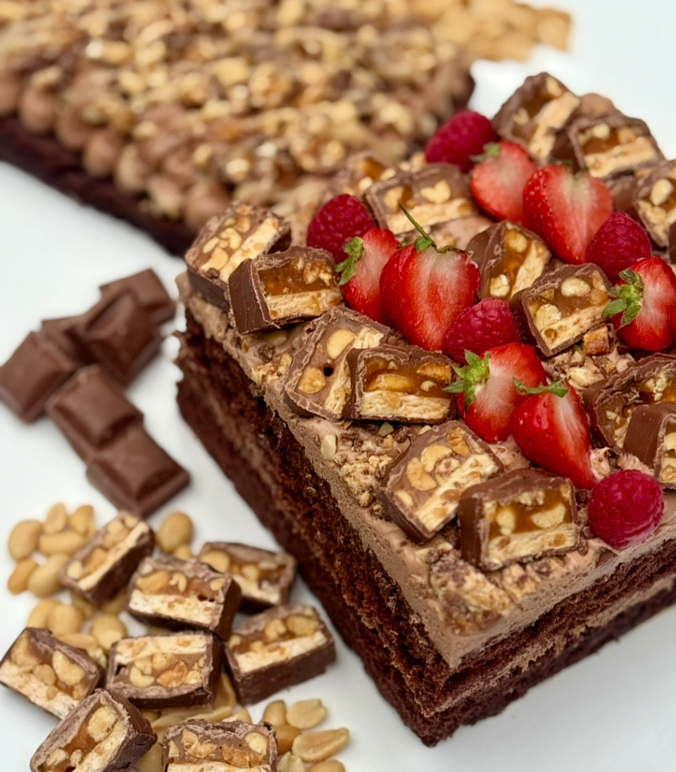 Caramel peanut snickers ganache cake
